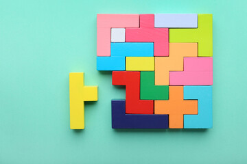 Multicolored puzzle and cubes on a blue background