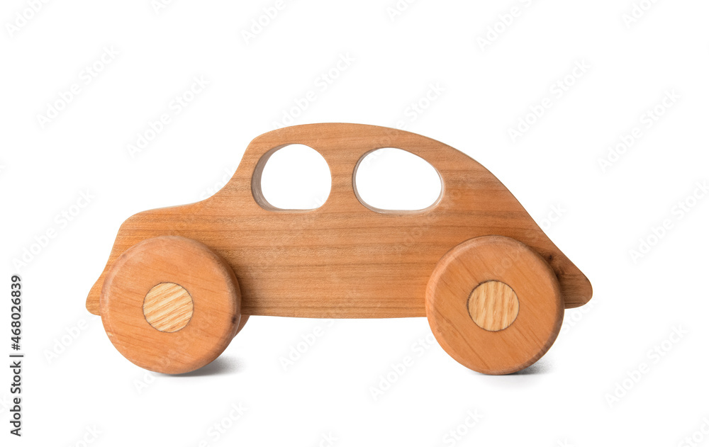 Wall mural Wooden car on white background