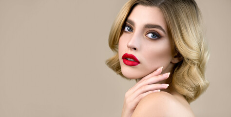 Portrait of beautiful young woman's face  with perfect young skin and professional makeup with red lips. Skincare seasonal beauty concept.