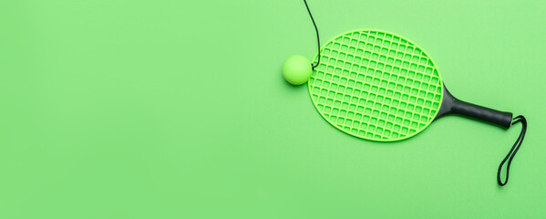 Green speedball racket and ball on green background. Horizontal sport theme poster, greeting cards,...