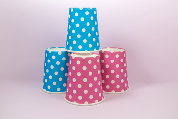 Blue and pink polka dot paper cup on the pink background - Powered by Adobe
