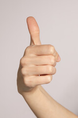 like thumb up gesture isolated on gray background
