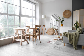 Modern living room interior with stylish mirror, sofa and table