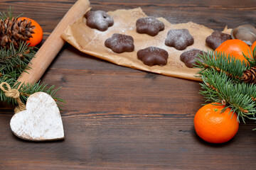 tangerines and chocolate chip cookies for Christmas on wooden background, place for object,