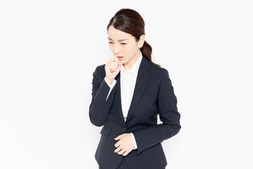 喉が痛いポーズをするビジネスウーマン