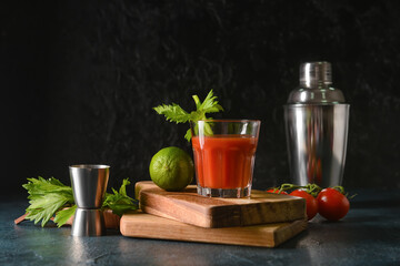 Boards with glass of bloody mary on table - obrazy, fototapety, plakaty