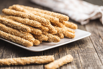 Breadsticks grissini. Bread sticks with sesame seeds.
