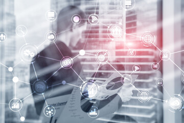 Double exposure mixed media. Diagrams structure on hologram screen. Business people and modern city on background