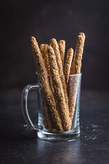 Breadsticks grissini. Bread sticks with sesame seeds.