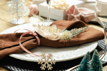 Christmas table setting place on wooden background.