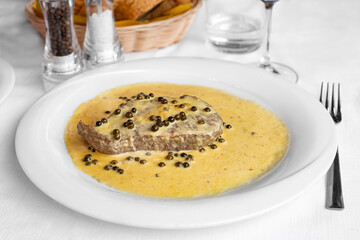Beef fillet with green peppercorn, italian dish. Filetto al pepe verde.