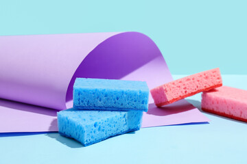 Cleaning sponges on blue background