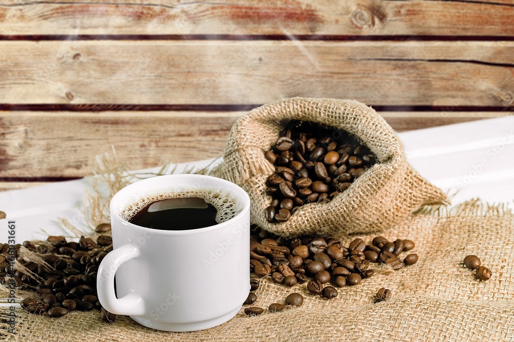 Sticker coffee beans with a cup of hot coffee on wooden desk