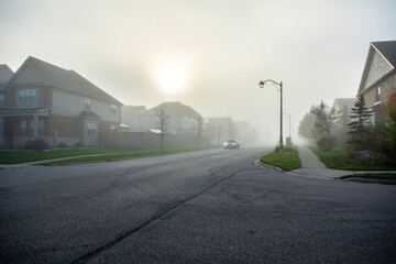 Morning street in autumn fog in fog
