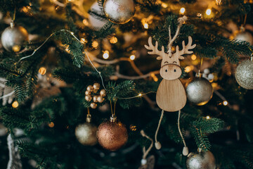 Christmas toys hanging on christmas tree