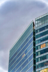 Fototapeta na wymiar Large building exterior with blue tinted glass curtain walls at Salt Lake City, Utah