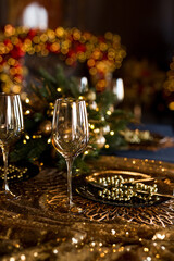 Empty glasses close up. Beautiful table setting with Christmas decorations in living room
