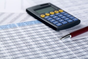 Calculator and Pen on Financial Figures