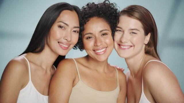 Beauty Portrait of Three Diverse Multiethnic Models on Isolated Background. Beautiful Happy Asian, Black and Caucasian Women with Natural, Healthy Skin. Wellness, Spa, Cosmetology, Skincare Concept.