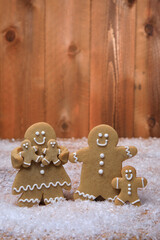 Family of Gingerbreads with 3 kids on Holiday Christmas Background