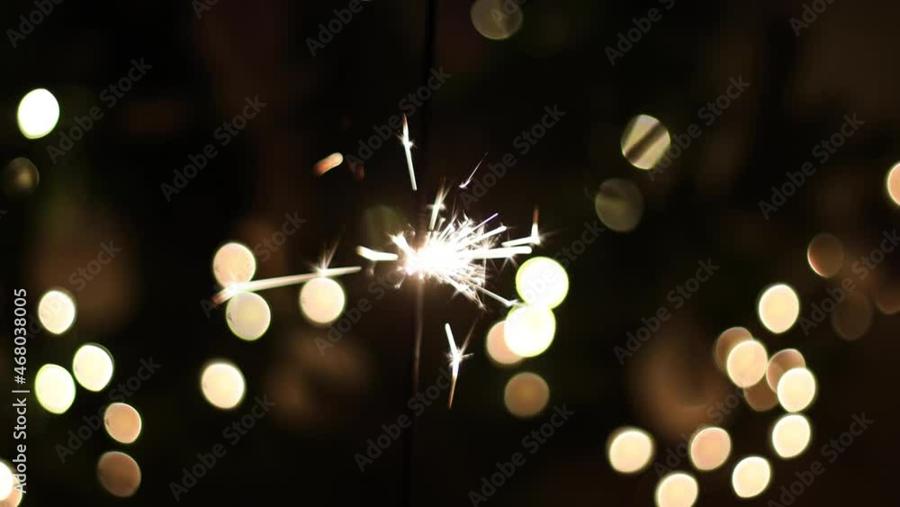 Wall mural happy new year and merry christmas. beautiful burning firework on dark background with golden lights