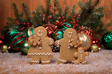 Family of Gingerbreads with 3 kids on Holiday Christmas Background