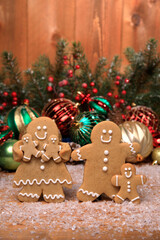 Family of Gingerbreads with 3 kids on Holiday Christmas Background