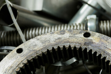 Detail of a gear wheel thrown in scrap metal.