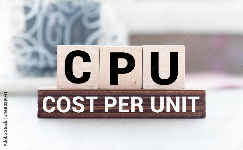 Poster text cpu cost per unit on wooden block, business concept image with soft focus background