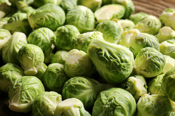 Fototapeta na wymiar Fresh raw Brussels cabbage on table, closeup
