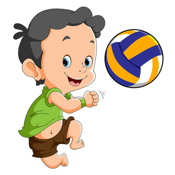 The happy boy is playing the volley ball