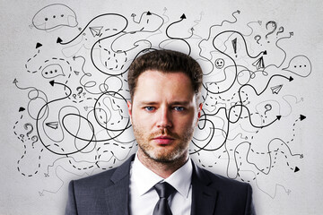 Portrait of attractive young european businessman on concrete wall background with arrows and thought icons sketch. Solution, direction, success and brainstorm concept.