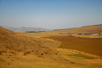 Fototapeta na wymiar Landscape with mountains, and yellow fields