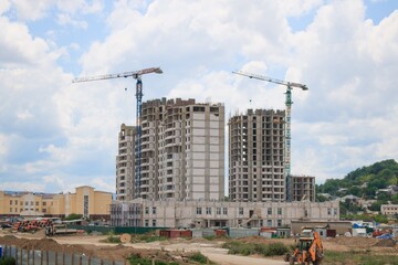 Obraz premium Advertisement on the construction site with crane