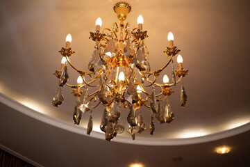 Expensive exquisite crystal chandelier in Victorian style indoor