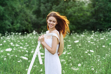 Woman in white dress flowers nature walk charm