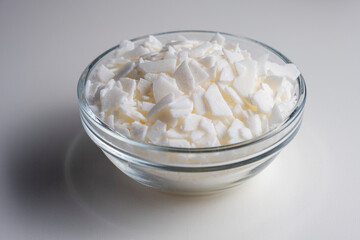 Set for crafting candle. Eco soy wax on white table. DIY candle. Hobby concept.