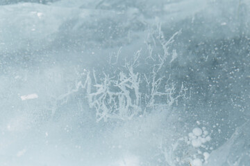 Beautiful ice of a frozen lake. Close-up.