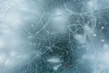 Beautiful ice of a frozen lake. Close-up.