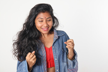 Young attractive Asian Indian woman pose face body expression mode emotion on white background shocked surprise scared eyes closed anticipation