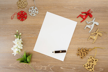 Preparing a letter to Santa Claus for Christmas with blank space and pen