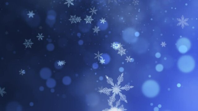 White snowflakes and blue bokeh with glitters falling, holidays and winter style background for Happy New Year and Merry Christmas