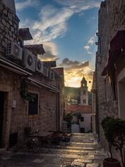 Early morning street scene with rising sun in the background in Dubrovnik, Croatia.