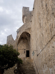 Arch and doorway within fortified city wall surrounding city of Dubrovnik, Croatia.