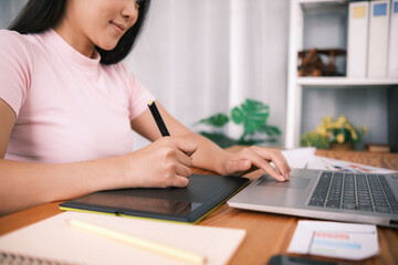 Young Asian woman freelance designer interface UI UX designer web design close up sketching drawing...