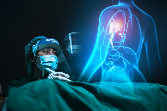 Surgeon female doctor using holographic simulation technology concept, operating procedure on patient using computer ai tech assistant, operating on human body medical healthcare futuristic innovation