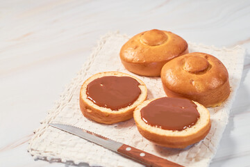 Mexican bisquet or biscuit bread, halved with caramel.