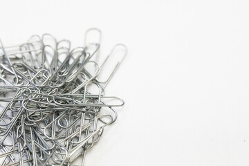 Silver metal paper clips to be use in offices and schools.