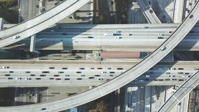 Aerial downtown Los Angeles. Cars traffic on freeway roads in center LA. Metro trains station on highway. urban life modern city in California, America. Drone 4k.