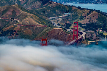 Clouds and Fog Float over the Iconic Golden Gate Bridge as It Crosses over to Sausalito in San...